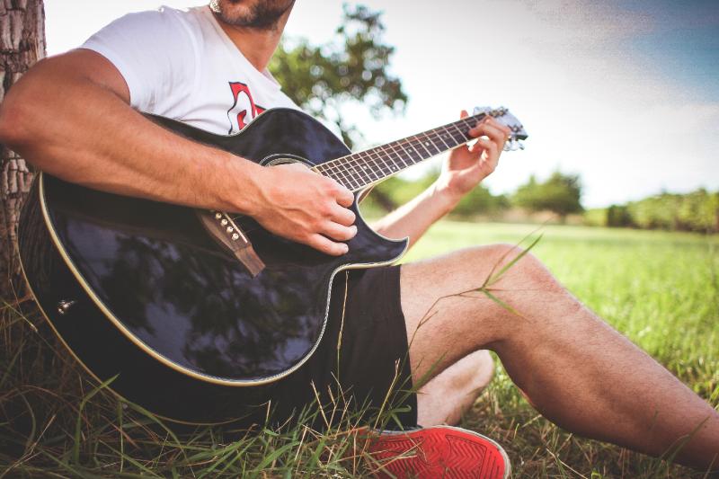 guyplayingacousticguitarinnaturepicjumbocom.jpg