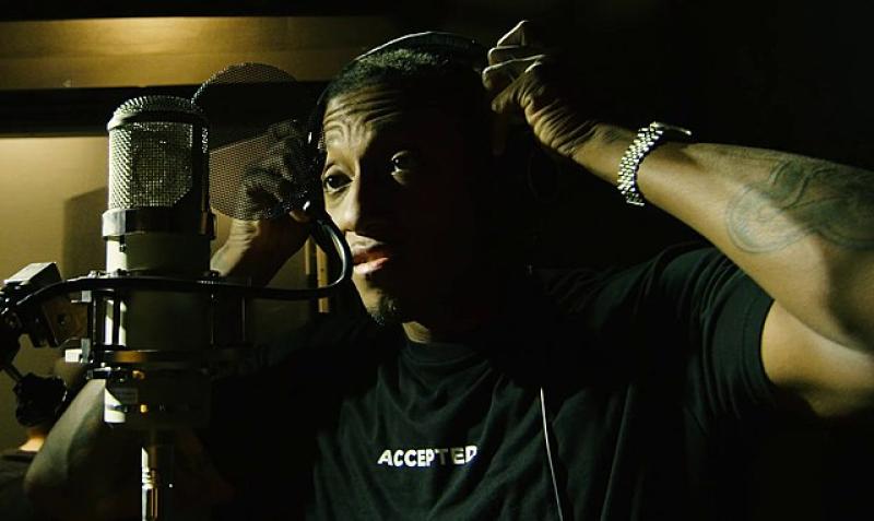 rapper-Lecrae_in_a_recording_studio.jpeg
