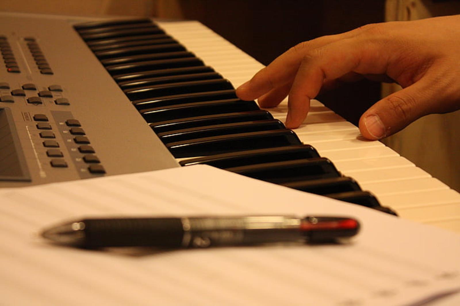 hand-piano-sheet-music-ball-point-pen-preview.jpeg